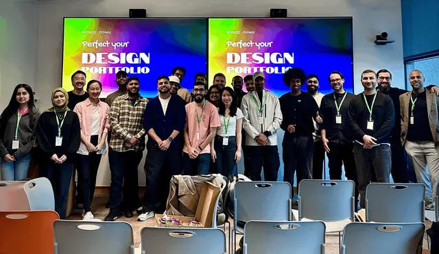 Group photo in front of the Perfect Your Design Portfolio slides